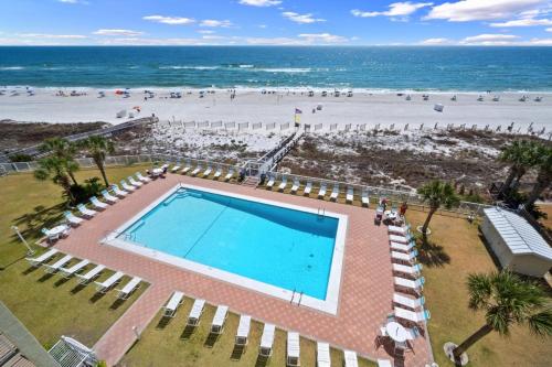 an overhead view of a swimming pool and the beach at Sunswept 607 condo in Orange Beach