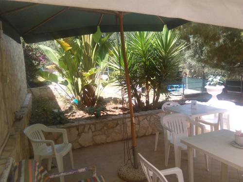 Κήπος έξω από το Residence Dolce Far Niente