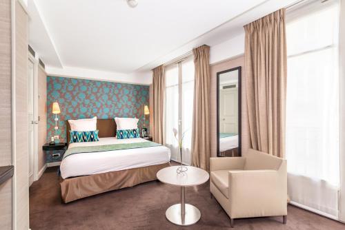 Katil atau katil-katil dalam bilik di Hôtel Duo