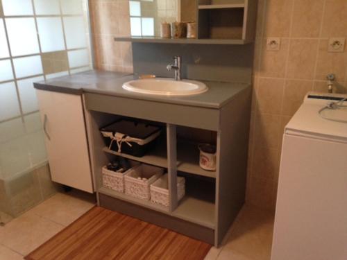 a bathroom with a sink and a counter with a sink at Gite d'Isa in Saint-Remèze