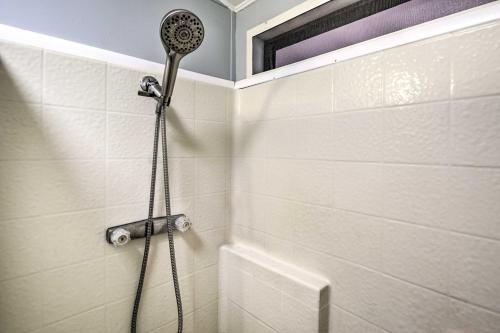 a shower with a shower head in a bathroom at Sun-Dappled AZ Abode with River and Mtn Views! in Parker