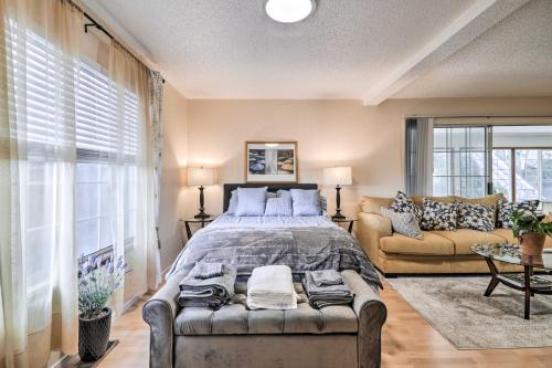 a bedroom with a large bed and a couch at Peaceful Oakland Oasis with Private Yard! in Oakland