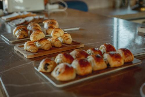 a bunch of croissants and buns on a table at Finca Gomera - Agroturismo Hotel in Cala Pi