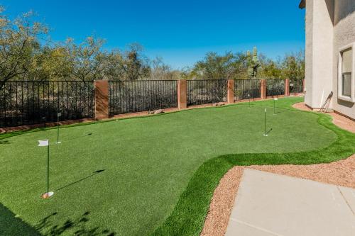 a golf course with three golf balls on the grass at Habanero Hideaway in Oro Valley