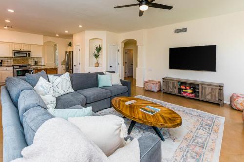 a living room with a couch and a table at Habanero Hideaway in Oro Valley