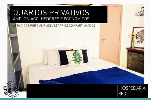 a poster of a bedroom with a bed with blue sheets at Hospedaria Rio in Rio de Janeiro