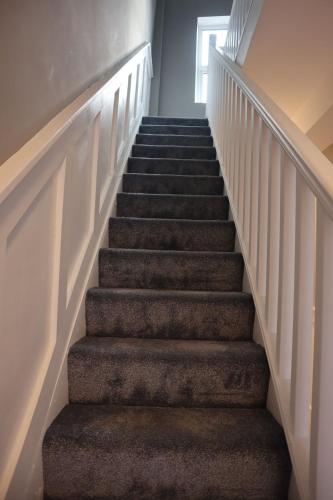 a flight of stairs with a stair case at 4 Eyre Square Lane in Galway
