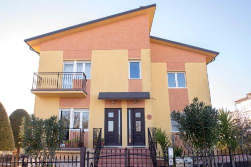 a house with a fence in front of it at N247 - Numana, meraviglioso quadrilocale in posizione strategica in Numana