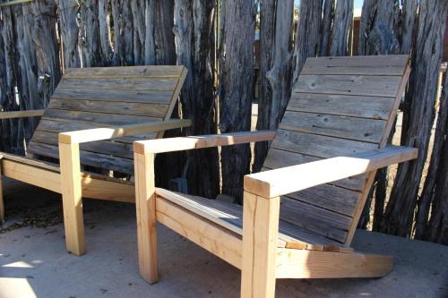 two wooden chairs sitting next to each other at Canyon Lakeview Resort in Canyon Lake