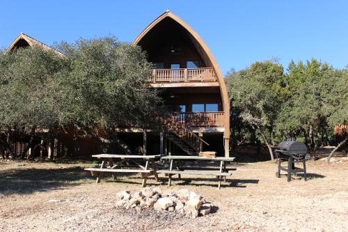 a group of sheep laying in front of a building at Canyon Lakeview Resort in Canyon Lake