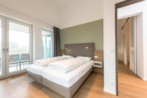 Postel nebo postele na pokoji v ubytování Apartmentvilla Anna See Apartmentvilla Anna See 3-01
