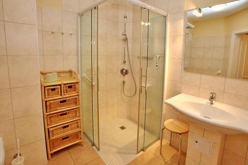 a bathroom with a shower and a sink at Dünenschloss Dünenschloss 2-07 in Kühlungsborn
