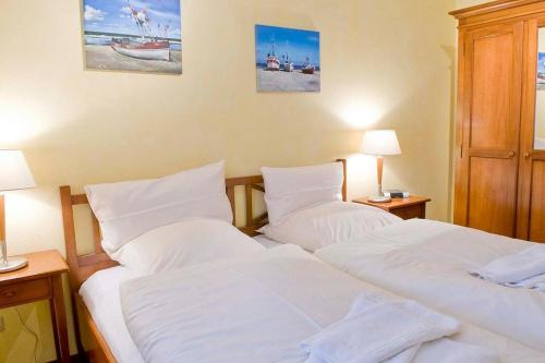 Postel nebo postele na pokoji v ubytování Urlaubsräume am Meer Urlaubsräume am Meer 4-12