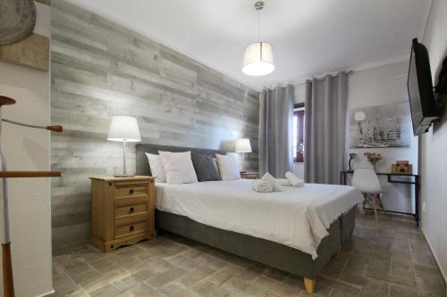 Postel nebo postele na pokoji v ubytování Marvin T2 com terraço