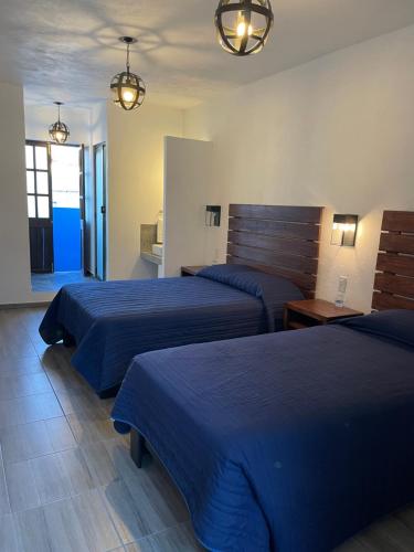 Postel nebo postele na pokoji v ubytování Hotel Casa Azul
