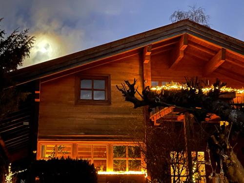 a house with christmas lights on the roof at Landhaus de Gaspary in Seehausen am Staffelsee