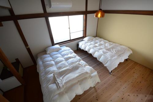 Giường trong phòng chung tại Guesthouse giwa - Vacation STAY 14229v