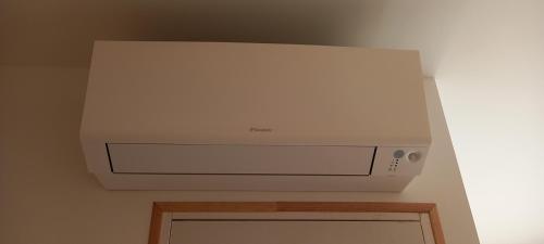 a white printer sitting on top of a wall at Demeure de la Garenne in Montmirail