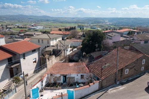 an aerial view of a town with roofs at La Pergola in Gergei