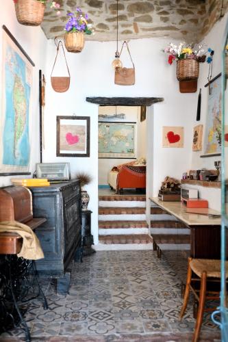 a room with a staircase and a room with a bed at La Pergola in Gergei