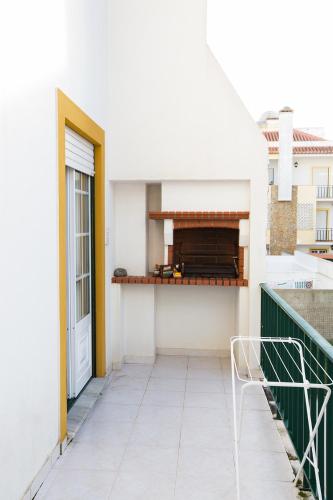 a balcony with a view of a building at WATERS HOUSE - Feel at Home ir our Sea in Peniche