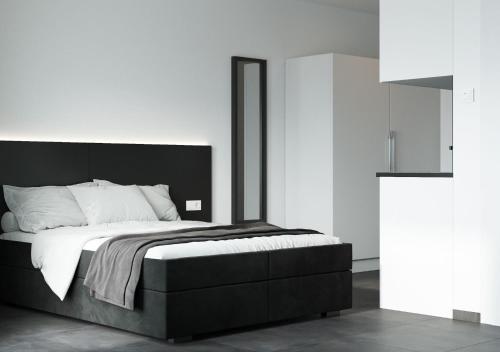 Postel nebo postele na pokoji v ubytování The Residences - Apartments Frankfurt