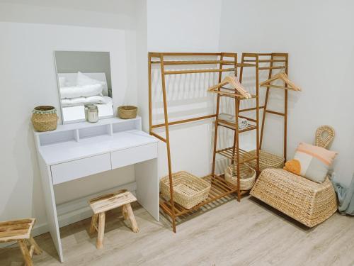 a bedroom with a bunk bed with a desk and a shelf at T3 Moderne Ultra Centre Arcachon in Arcachon
