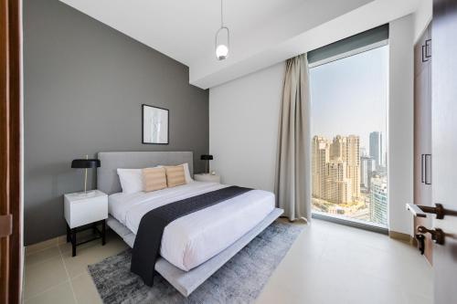 Letto o letti in una camera di EDEN'S Homes & Villas - 52-42 Emaar