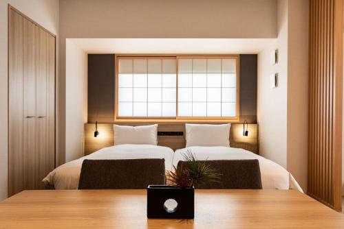 Tempat tidur dalam kamar di MIMARU TOKYO UENO INARICHO