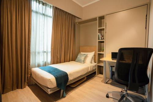 Ένα ή περισσότερα κρεβάτια σε δωμάτιο στο Great World Serviced Apartments