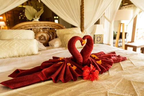 Letto o letti in una camera di Tanah Damai Hotel