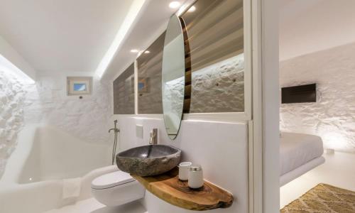 a bathroom with a sink and a bath tub at Luxury Ocean View Villa Mykonos Centre in Mikonos