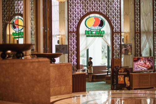 a lobby of a hotel with a sign on the wall at Hanoi Daewoo Hotel in Hanoi