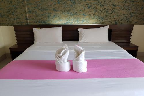 Ein Bett oder Betten in einem Zimmer der Unterkunft Poonsook Phitsanulok Hotel SHA Plus