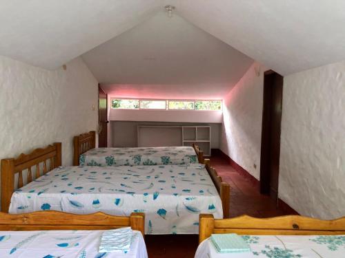 En eller flere senger på et rom på Finca La Dacha
