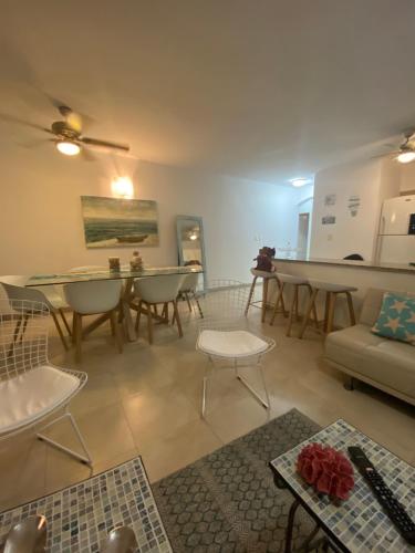 a living room with a couch and tables and chairs at CostaSame Casablanca in Same