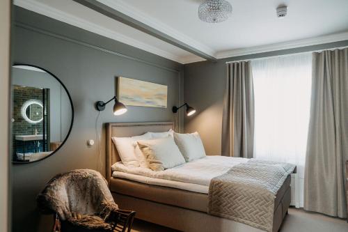 Voodi või voodid majutusasutuse Lillan Boutique Hotel & Kök toas
