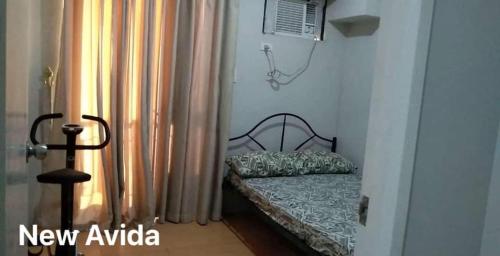 Giường trong phòng chung tại New Avida JVB Homestyle