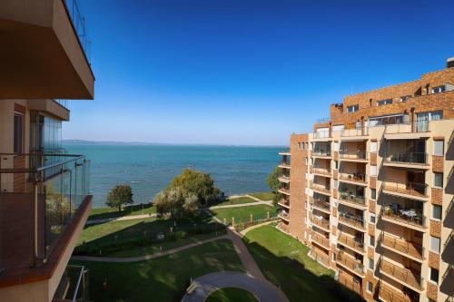 a view of the ocean from a building at Galerius Golden Beach Apartment in Siófok