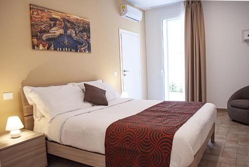 a hotel room with a bed and a window at Borgo San Lorenzo Roma in Rome