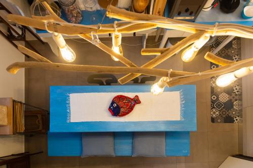 a hat on a table in a room with lights at Residence Mersa in Brolo