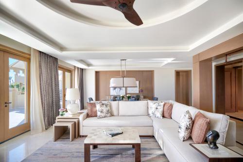 a living room with a couch and a ceiling fan at Four Seasons Resort Sharm El Sheikh in Sharm El Sheikh