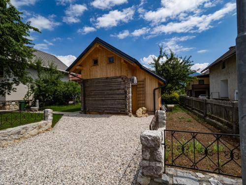 a barn with a gate in front of it at Chalet Sejalec in Lesce