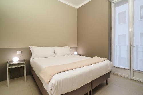 מיטה או מיטות בחדר ב-Contempora Apartments - Cavallotti 13 - B32