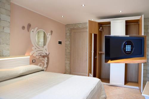 Postel nebo postele na pokoji v ubytování Locazione Turistica Arcobaleno "Appartamento Superior"