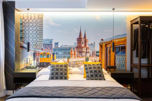a balcony with three beds with a view of a city at Fly Rooms Madrid Airport in Madrid