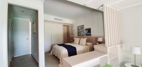 a hotel room with a bed and a staircase at Apartamentos Casas Carmen - Adults Only in Playa del Ingles