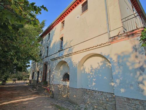 a building with two bikes parked next to it at Farmhouse in Umbertide with Pool in Umbertide