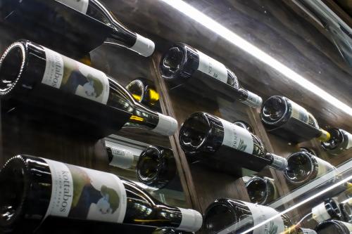 a bunch of wine bottles in a wine cellar at TimBila Safari Lodge in Omaruru