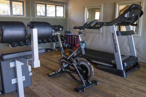 a gym with two exercise bikes in a room at TimBila Safari Lodge in Omaruru